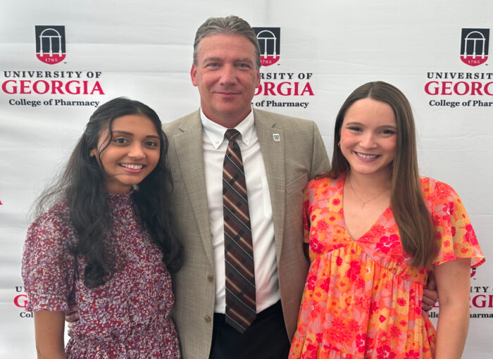 Chuck Page (c) of Kroger with recent graduates who will begin work at Kroger pharmacy this summer. They are Bhavi Patel (l) and Hannah Chambers (r)